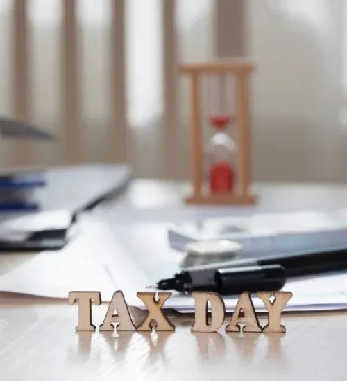 word-tax-day-composed-wooden-letters-coins-papers-pen-background-closeup-r7uip58vogghsr0gyd02188qe7fdsvru24hvgn6fek